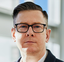 Alexander Hughes, executive and CEO of a crypto trading company, portrait